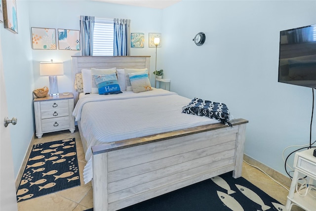 bedroom featuring baseboards