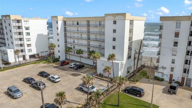 view of building exterior featuring uncovered parking