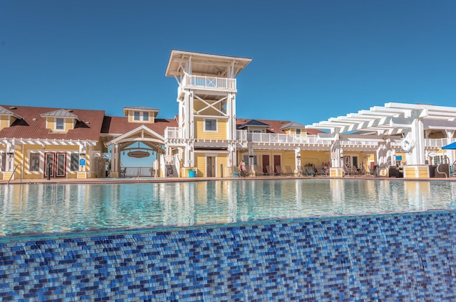 pool with a residential view and a pergola