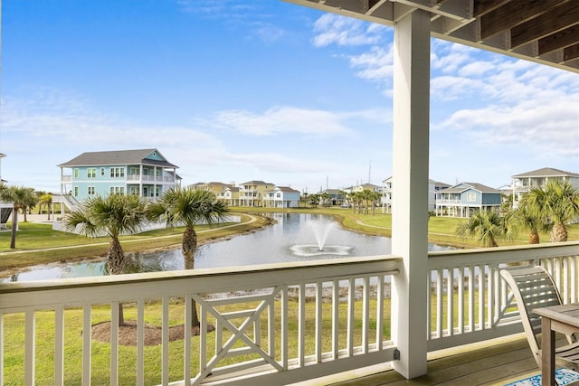 deck featuring a residential view and a water view