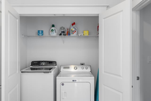 laundry room featuring washer and dryer and laundry area