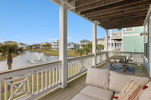 deck with a water view and a residential view