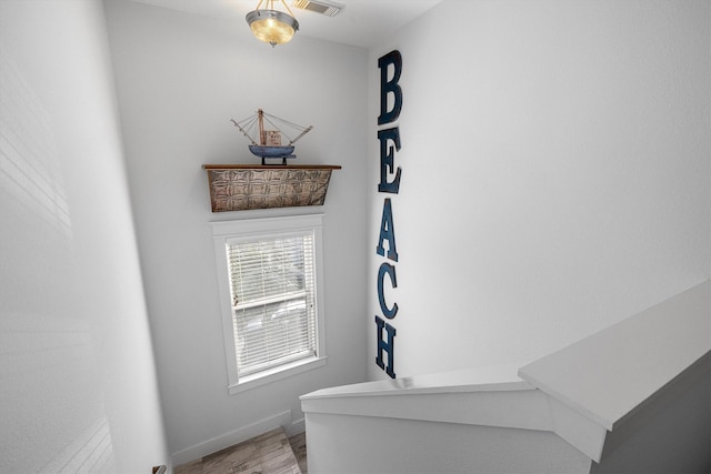 interior details featuring wood finished floors and baseboards