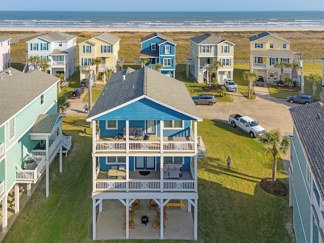 drone / aerial view with a residential view and a water view