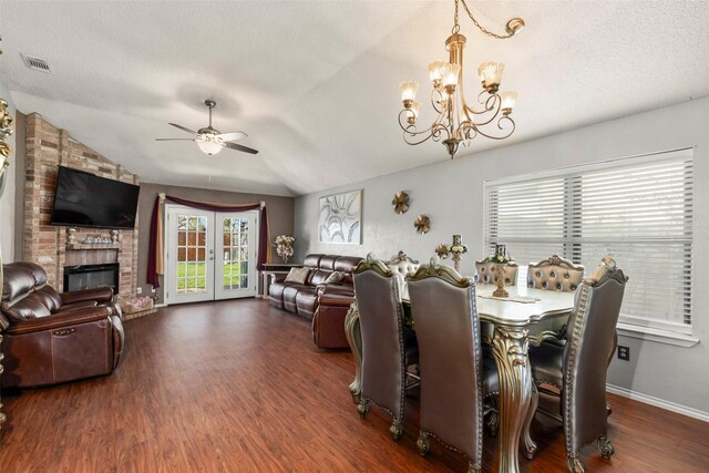 dining room with plenty of natural light, baseboards, ceiling fan with notable chandelier, and wood finished floors