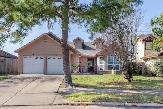 view of front of property with fence, an attached garage, brick siding, a front yard, and concrete driveway
