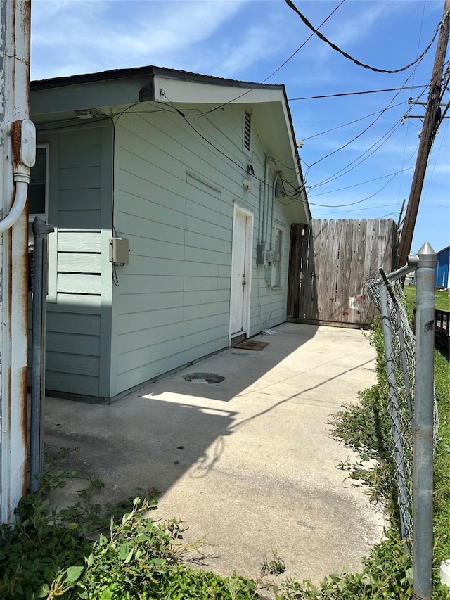 528 Kentucky St, Houston, TX 77587 - view of side of home featuring fence and a patio area