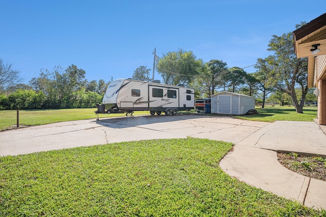 view of yard with an outbuilding and a storage unit