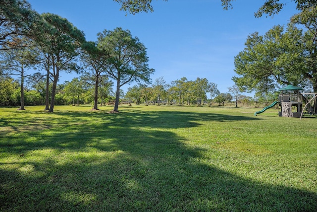 view of yard featuring playground community