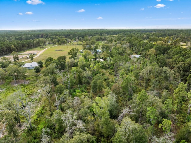 bird's eye view featuring a wooded view