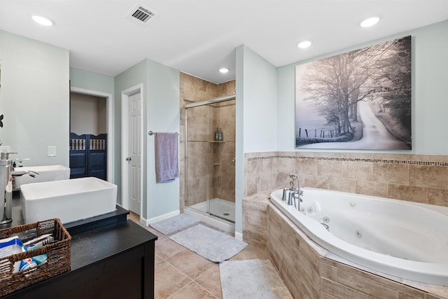 full bath with visible vents, a sink, a jetted tub, a shower stall, and double vanity