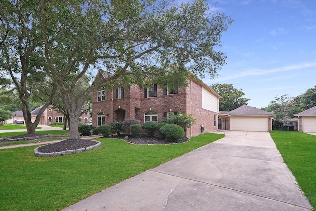 view of front facade with a front lawn, a garage, and brick siding