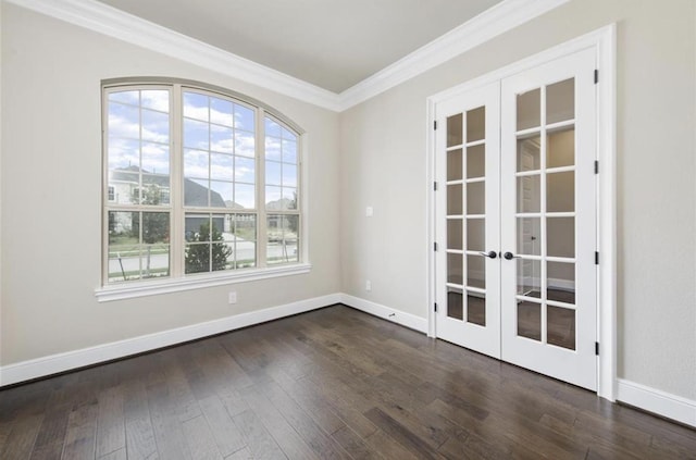 spare room with french doors, wood finished floors, baseboards, and ornamental molding