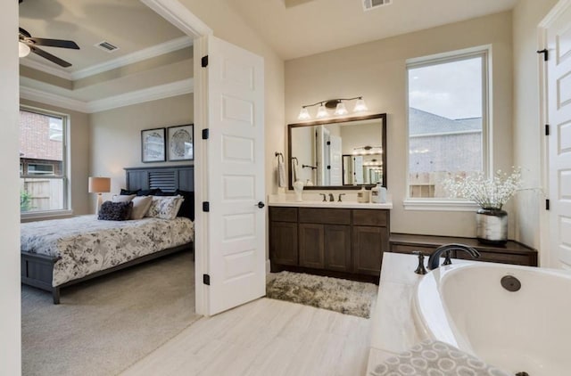 bathroom featuring ornamental molding, a ceiling fan, visible vents, and connected bathroom