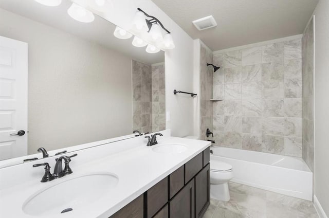 full bath featuring a sink, toilet, tub / shower combination, and double vanity