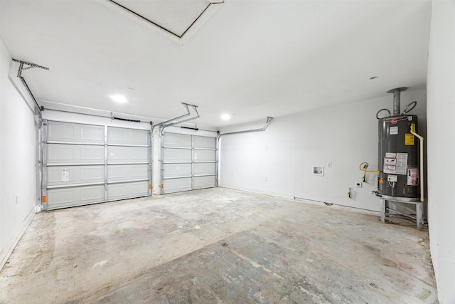 garage with gas water heater and baseboards