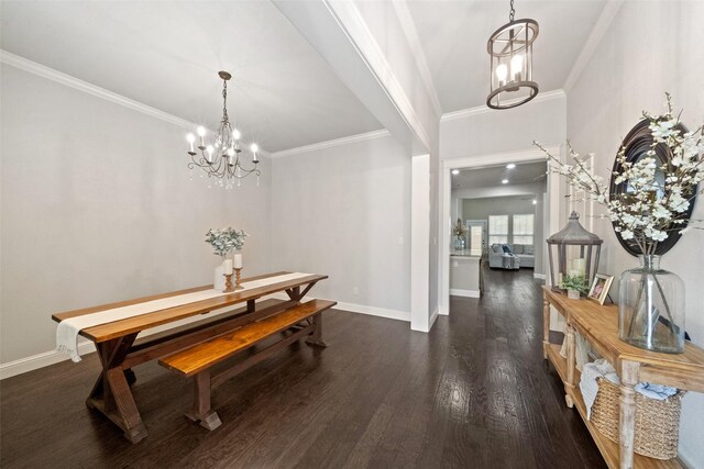 interior space featuring baseboards, a notable chandelier, dark wood-style floors, and ornamental molding