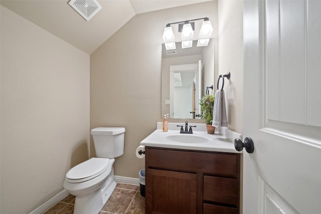 bathroom featuring visible vents, baseboards, toilet, vaulted ceiling, and vanity