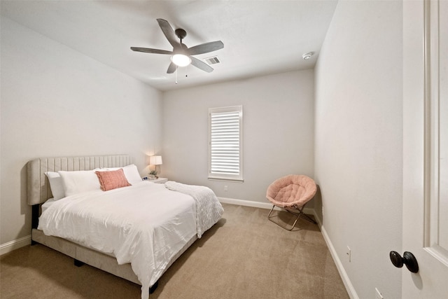 bedroom with visible vents, baseboards, carpet, and a ceiling fan