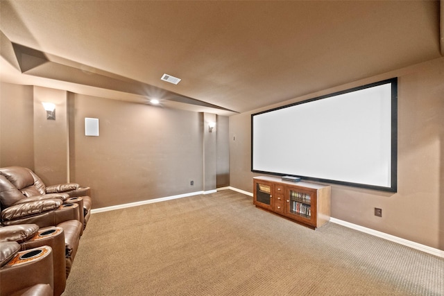 cinema room with baseboards, visible vents, and carpet floors