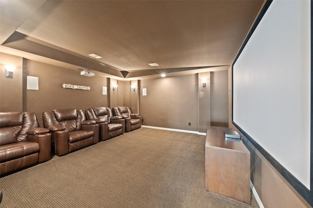 carpeted home theater with a tray ceiling, baseboards, and visible vents