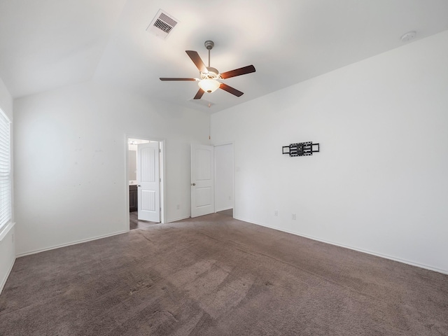 unfurnished room featuring visible vents, ceiling fan, carpet flooring, and vaulted ceiling