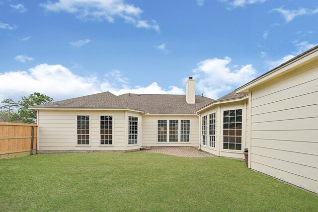 7419 Place Vendome, Spring, TX 77379 - back of property featuring a chimney, a patio area, and a shingled roof
