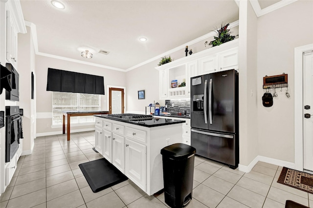 7419 Place Vendome, Spring, TX 77379 - kitchen with black appliances, dark countertops, white cabinetry, baseboards, and ornamental molding
