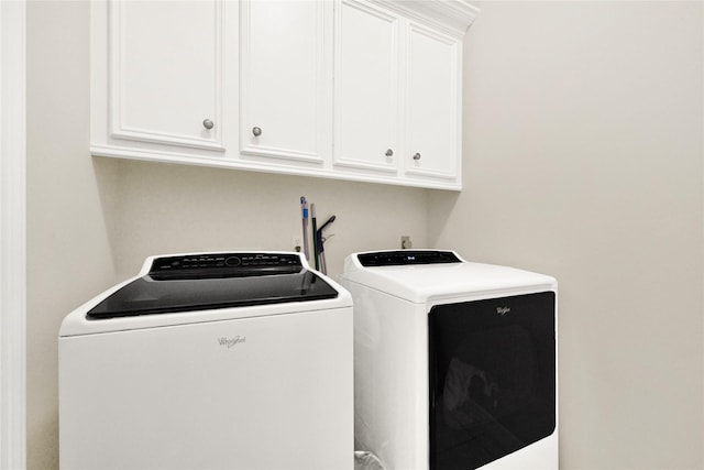 7419 Place Vendome, Spring, TX 77379 - washroom featuring independent washer and dryer and cabinet space