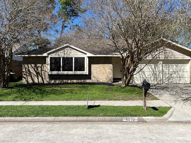 ranch-style house featuring a front lawn, an attached garage, brick siding, and driveway