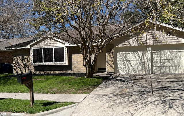 view of front facade featuring brick siding, an attached garage, and driveway