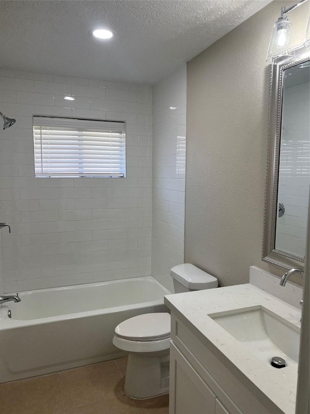 full bath featuring vanity, bathing tub / shower combination, a textured ceiling, tile patterned floors, and toilet