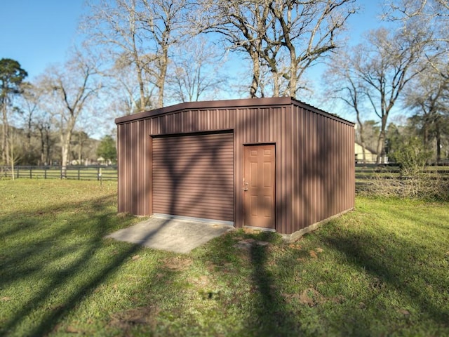 view of outbuilding featuring an outdoor structure and fence