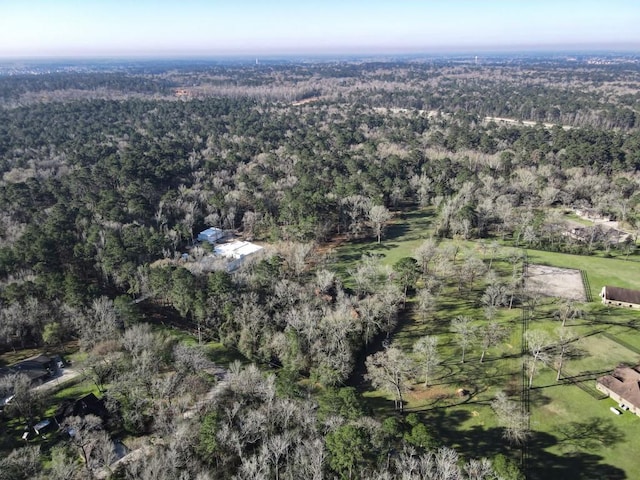 bird's eye view featuring a wooded view