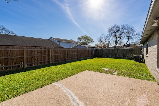 view of yard featuring cooling unit, a fenced backyard, and a patio area