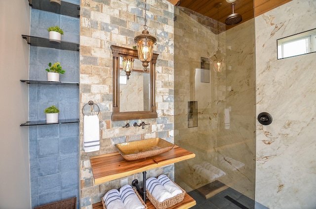 full bathroom featuring a sink and walk in shower