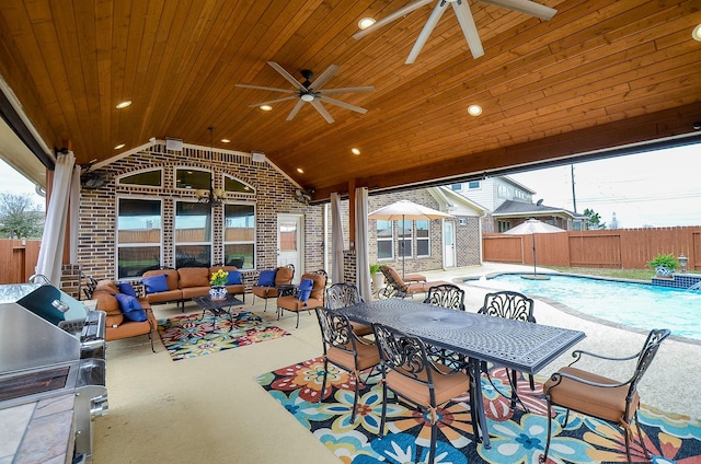 view of patio / terrace featuring outdoor dining space, a ceiling fan, fence, and an outdoor hangout area