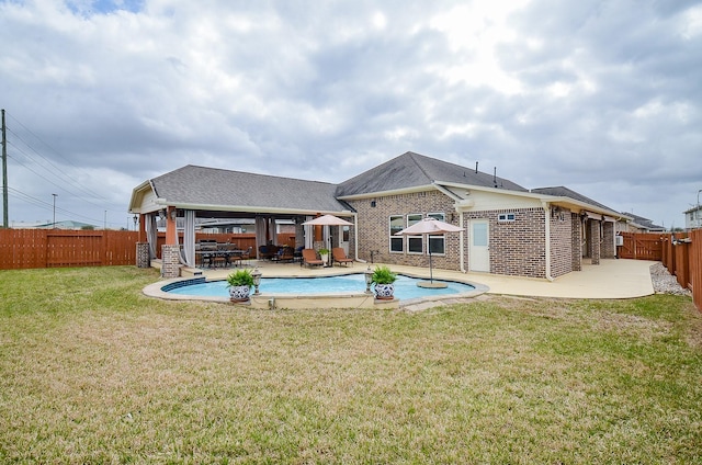 view of swimming pool featuring a patio, a fenced backyard, a fenced in pool, and a lawn