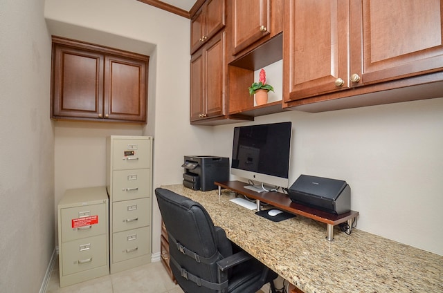 home office with light tile patterned floors and baseboards