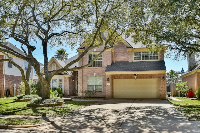 traditional home with concrete driveway, an attached garage, brick siding, and roof with shingles