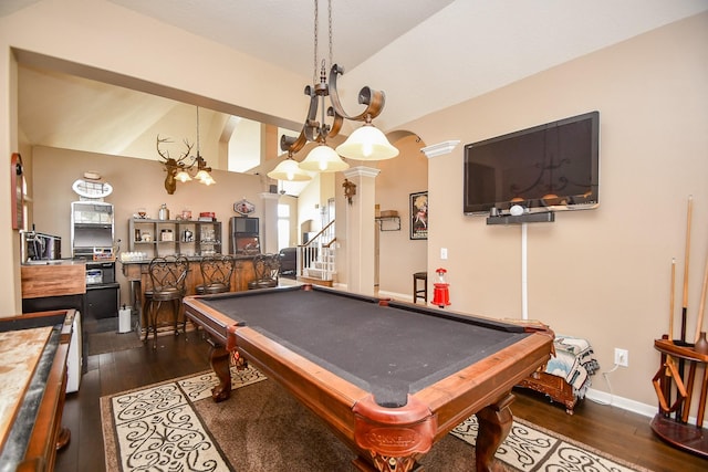 game room featuring dark wood-type flooring, billiards, arched walkways, baseboards, and a dry bar