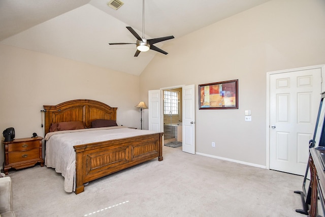 bedroom with visible vents, light carpet, high vaulted ceiling, ensuite bath, and baseboards