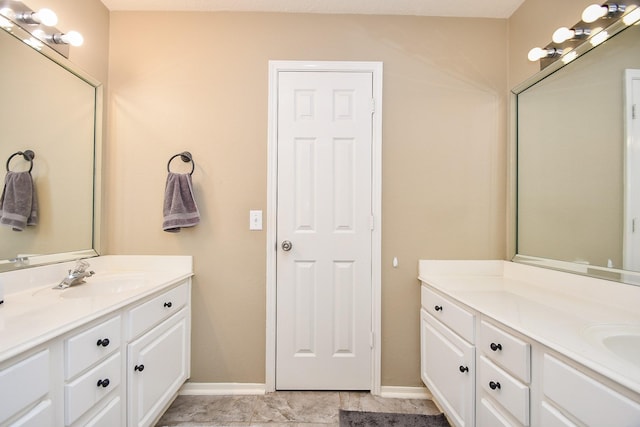 bathroom with baseboards and vanity