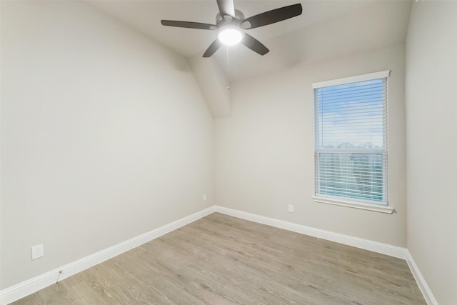 unfurnished room with ceiling fan, baseboards, and light wood-style flooring