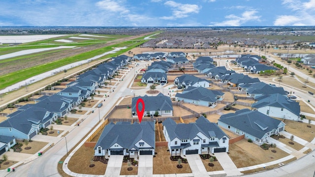 birds eye view of property with a residential view