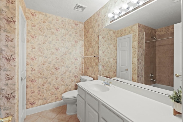 bathroom with visible vents, toilet, wallpapered walls, tile patterned flooring, and baseboards