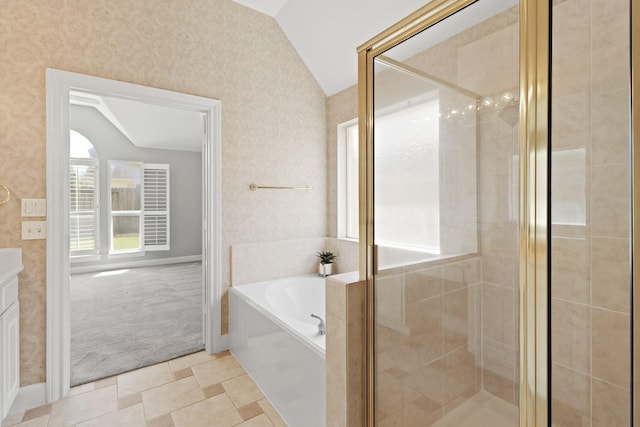 bathroom featuring a shower stall, wallpapered walls, lofted ceiling, a bath, and vanity