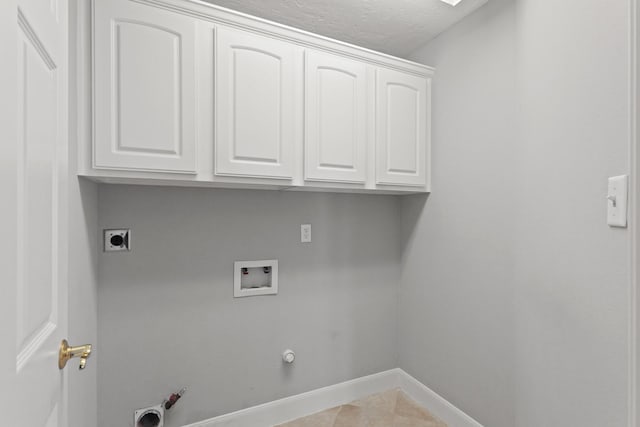 washroom featuring washer hookup, hookup for a gas dryer, cabinet space, baseboards, and hookup for an electric dryer