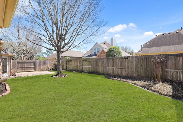 view of yard featuring a patio and a fenced backyard