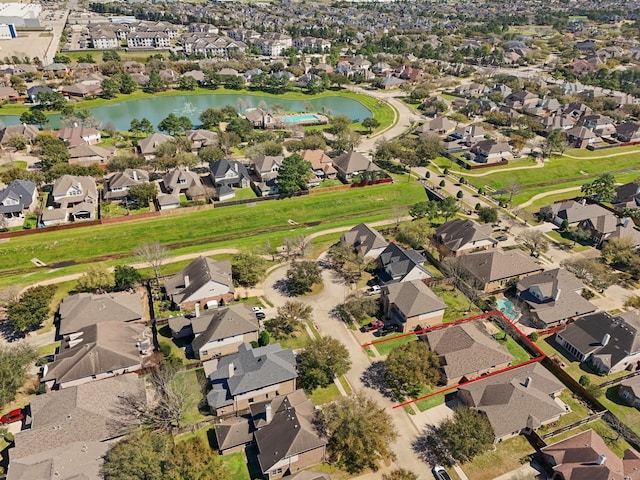 bird's eye view with a residential view and a water view